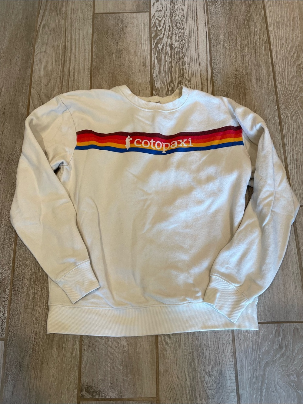 Cotopaxi Cream Sweatshirt with Rainbow Stripe